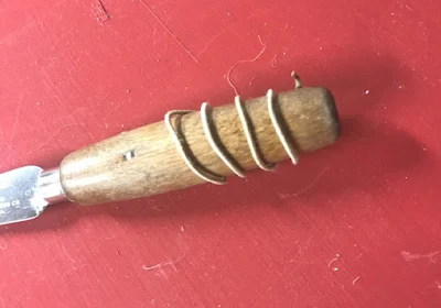 Coated wire wrapped around handle of tool