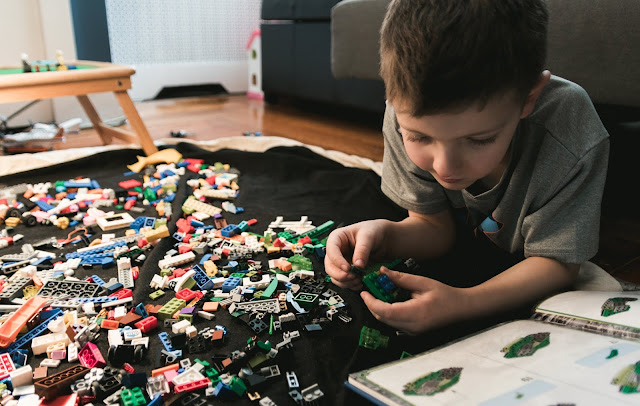Child Playing With Lego Blocks