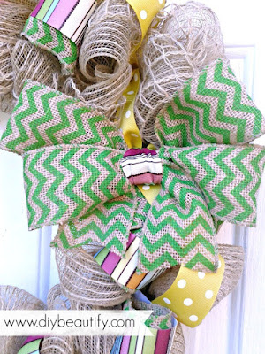 This deco mesh wreath is bright and includes a monogram painted to match! Find more at diy beautify.