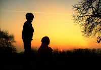 children in sunset shillouttes