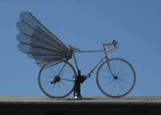 Winged road bike atop the Bike Hut.