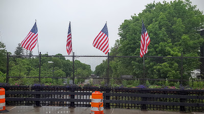 as the parking meters were removed for the construction on Main St,  the flags went into slots on the railing along the bridge