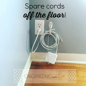Use a cord bundler to get spare cords off the floor :: OrganizingMadeFun.com