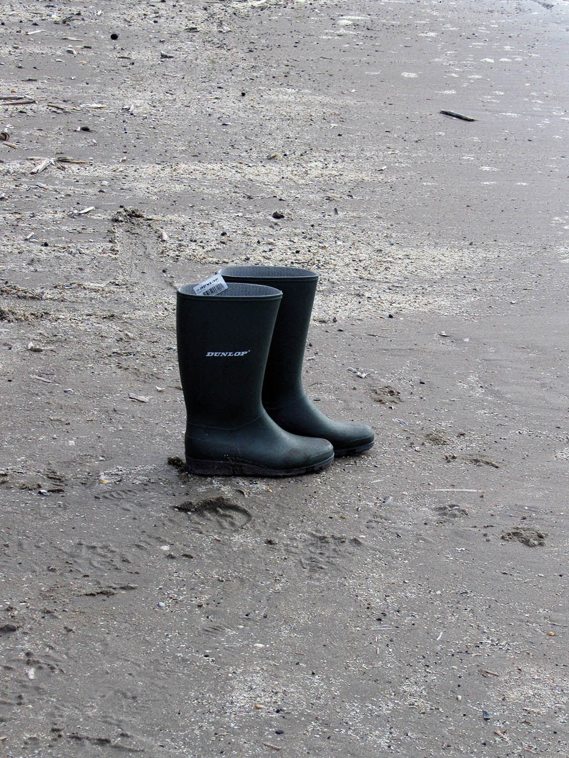 simplicity: two boots on the beach