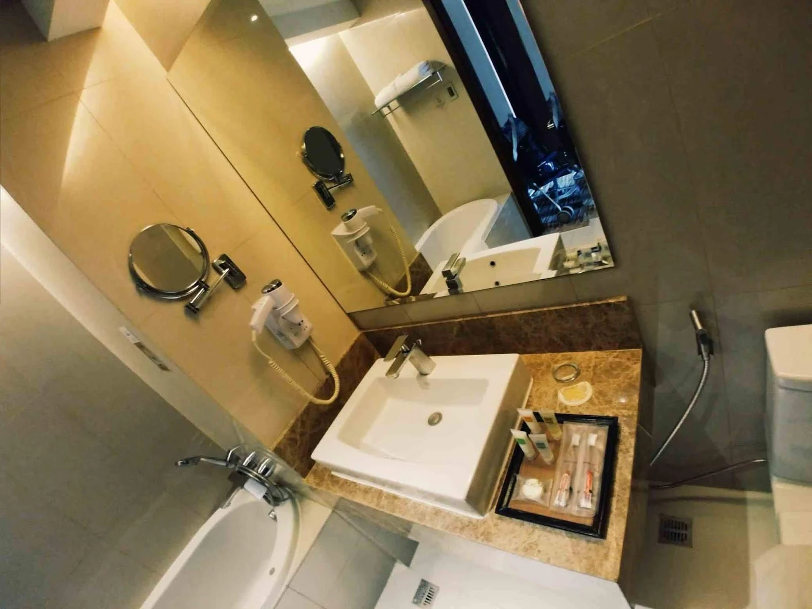 bathroom sink at Acacia Hotel