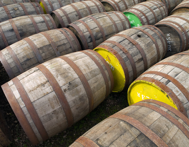 barrels at Arran Distillery, yellow and green barrelheads