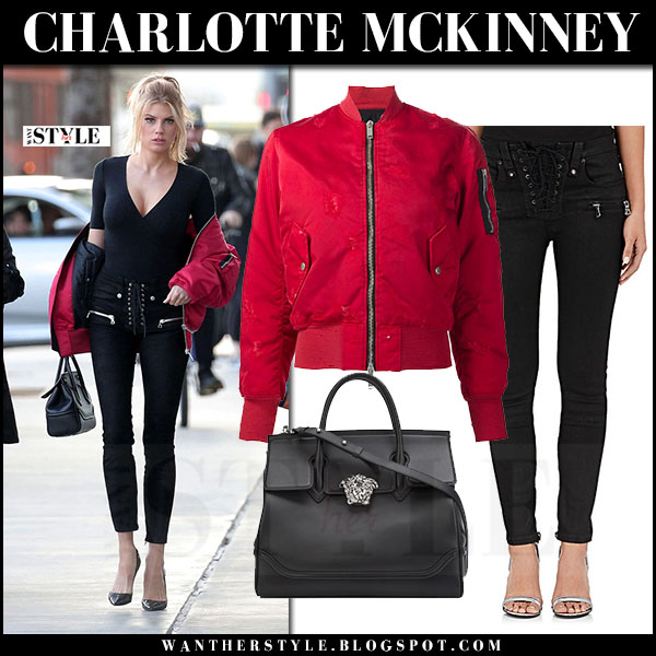 Charlotte McKinney in red bomber jacket and black lace up skinny jeans