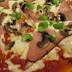 Pizza de jamón con champiñones