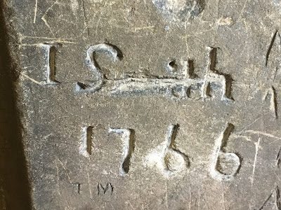 Stone with carved graffiti  reading 'J Smith 1766'