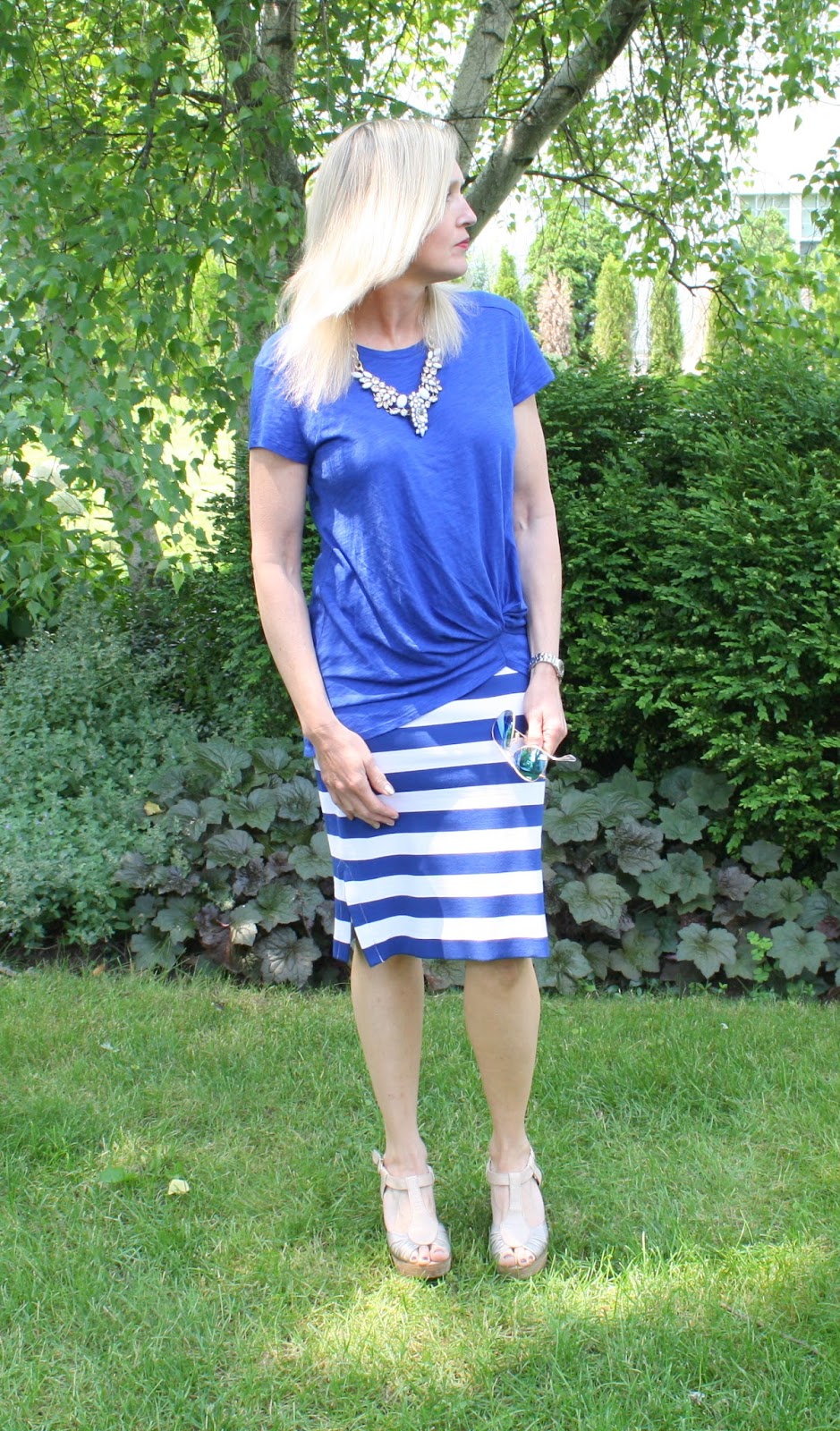 Happiness Boutique Snow White statement necklace with cobalt knotted tee and striped pencil skirt