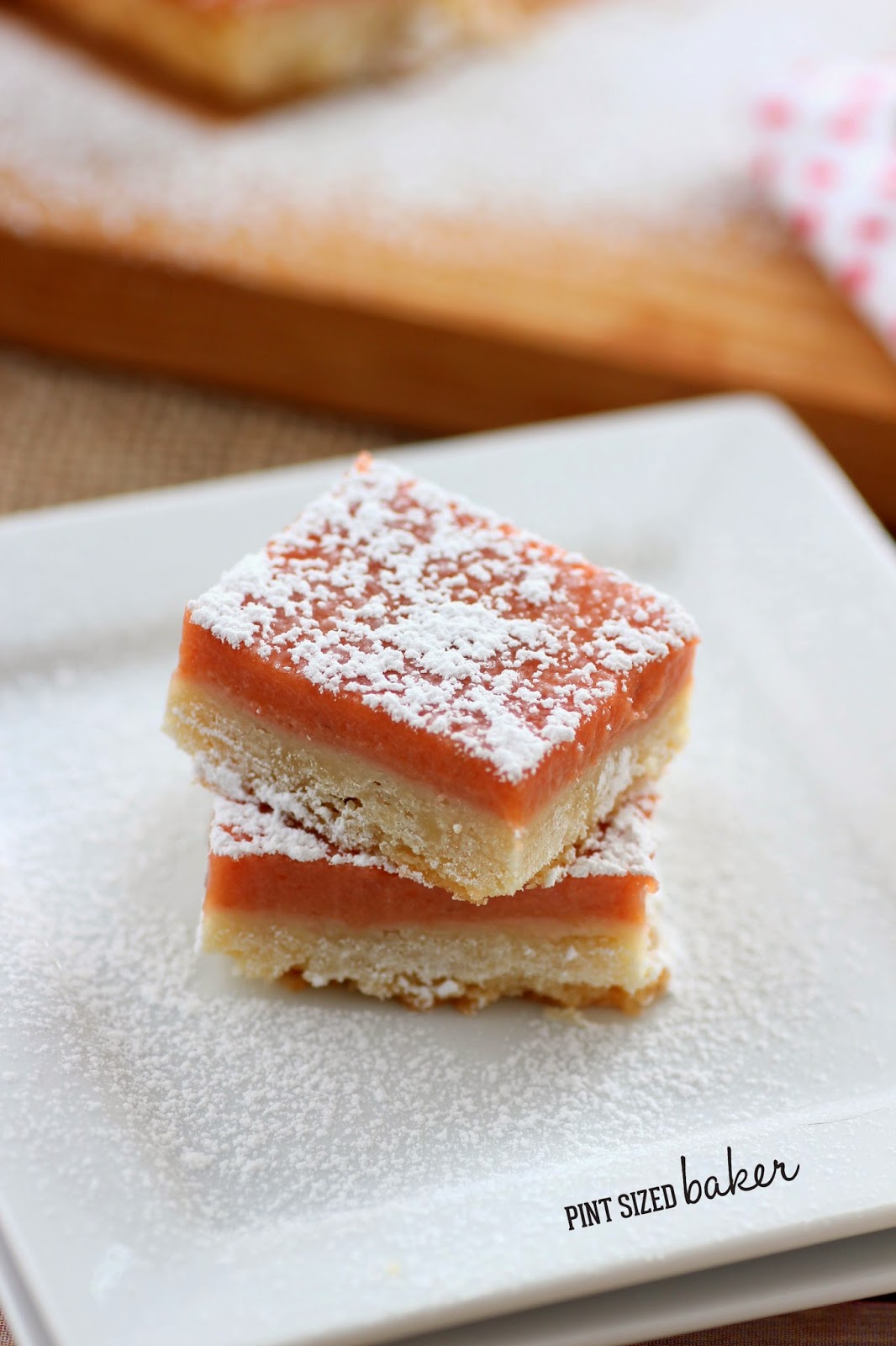 These easy Strawberry Shortbread Bars start off with a homemade strawberry rhubarb curd and end with a YUM! They are a great spring time treat!