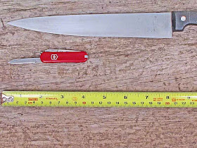 tape measure, metric, inches,pocket knife, kitchen knife, board
