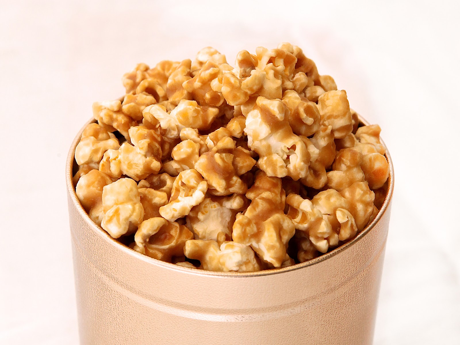 Caramel Popcorn Tin - $12 Freshly popped corn coated in a thick and crunchy...