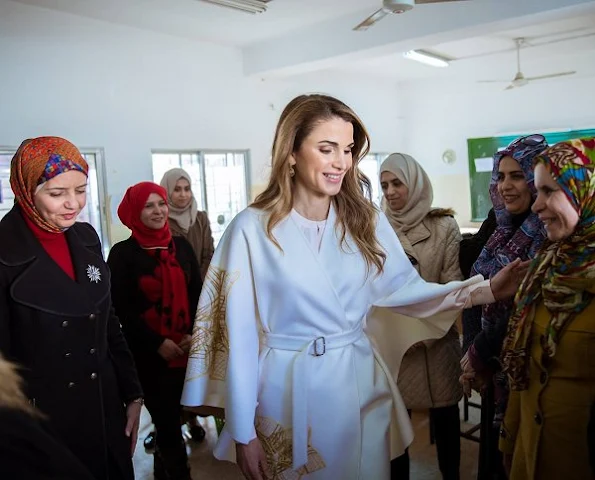 Queen Rania of Jordan wears Valentino coat and trousers, Valentino Rock Pumps and Valentino rock handbags