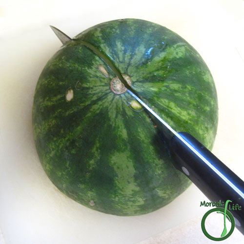 Morsels of Life - How to Cut a Watermelon Step 3 - Place watermelon cut side down, and cut in half again.