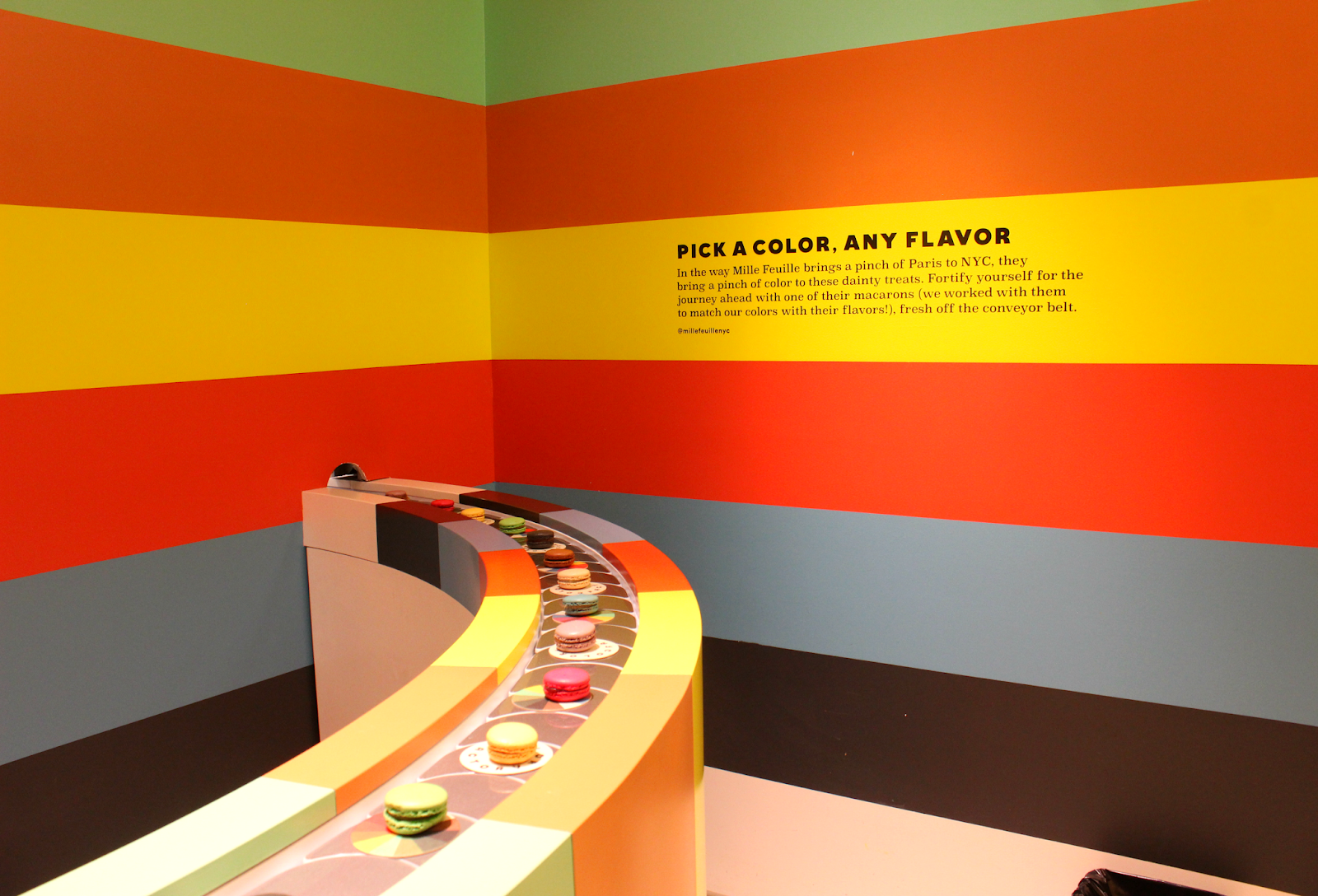 Macarons on a conveyor belt at Color Factory