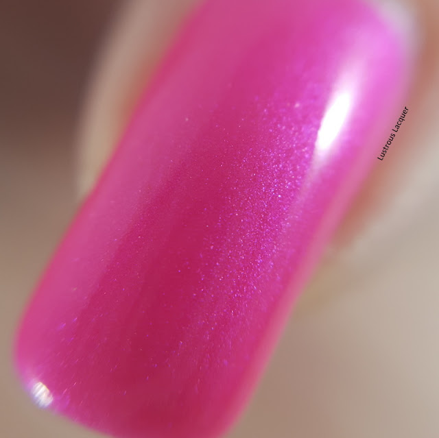 bright pink nail polish with iridescent shimmer
