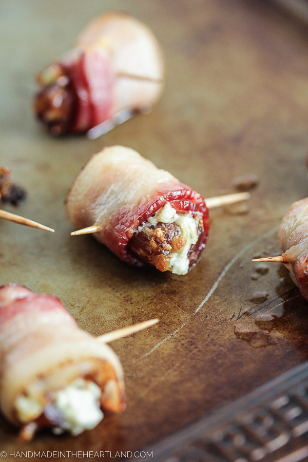 Bacon wrapped dates stuffed with blue cheese are the most delicious party appetizer.