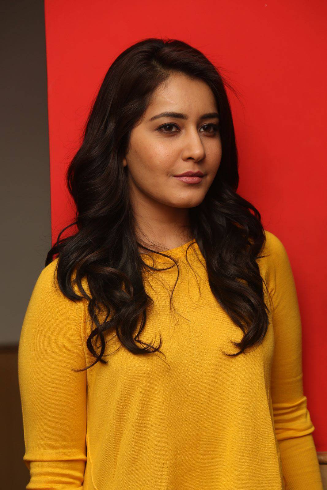 Rashi Khanna Stills In Yellow Dress At Bengal Tiger Movie App Launch