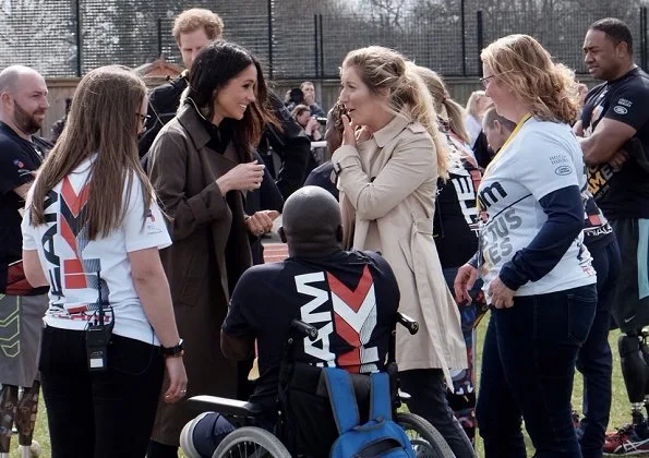 Meghan Markle wore Aritzia Babaton Bascom Trench Coat at Bath Sports Training Village. Invictus Games Sydney 2018. Meghan Markle fashion style