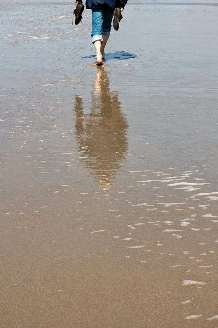 reflection of a man in the sea