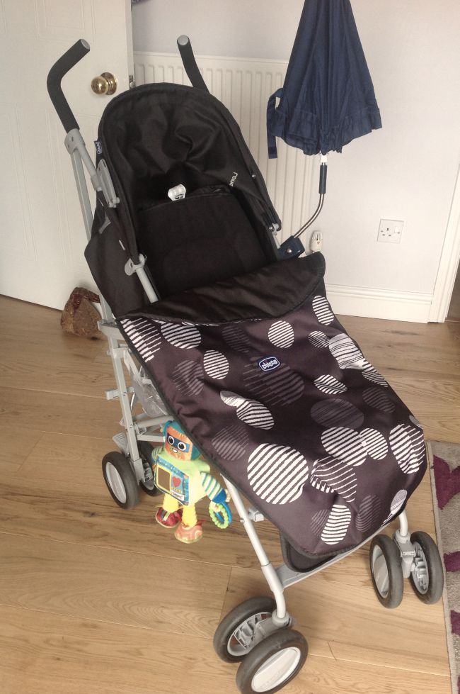 Picture of babies buggy with foot muff in black and white 