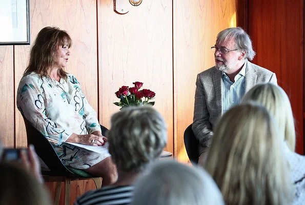 Princess Mette-Marit wore Ulla Johnson Wes bow embellished denim blouse. Crown Princess talked with Author Monica Isakstuen at Egersund library