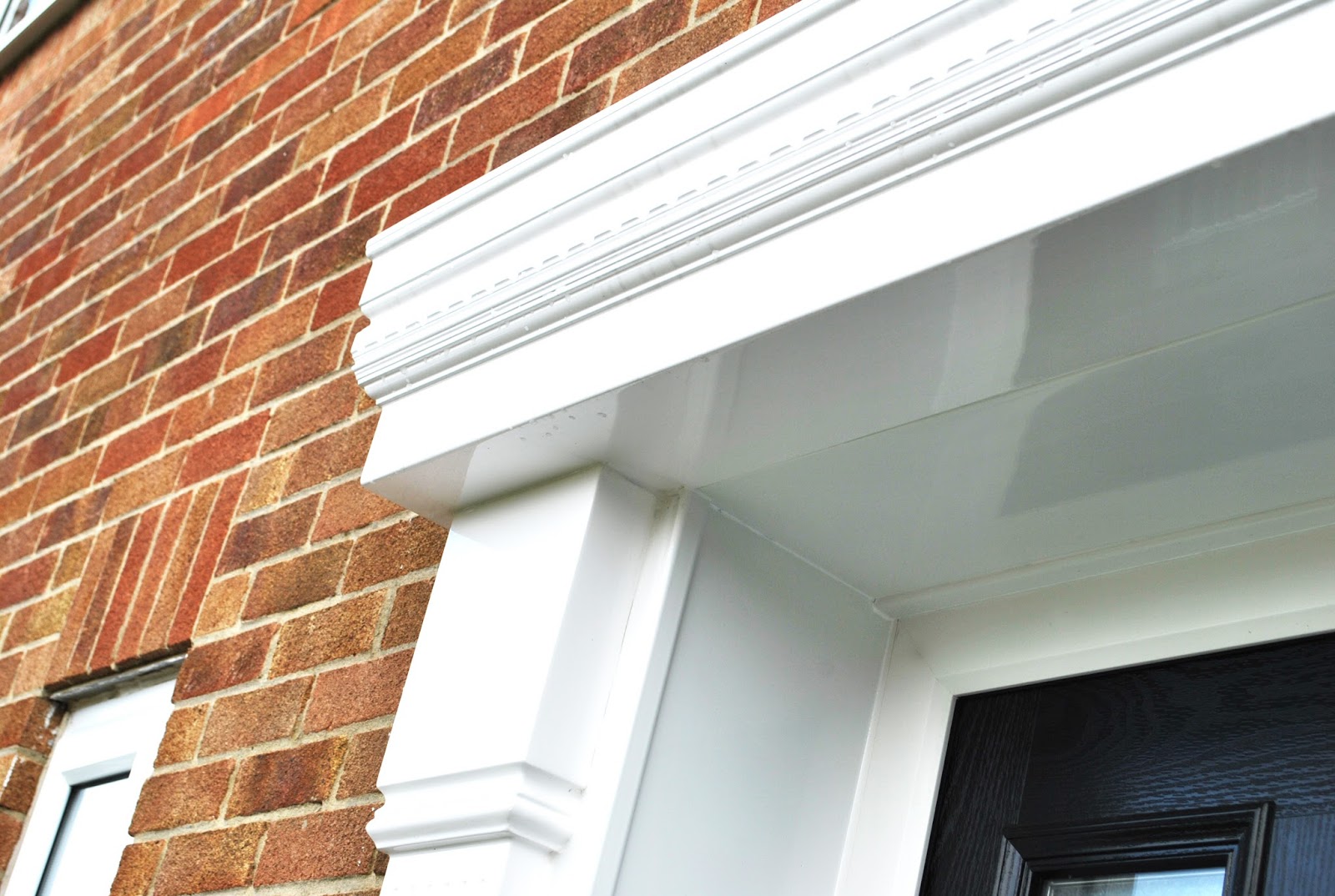 Black Altmore Composite Door and Cambridge Canopy Surround Feels Like