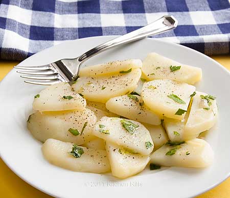 French Potato Salad made with cooked potato slices, oil, and vinegar