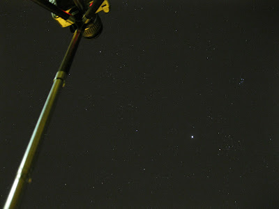 photo looking up below tripod at stars
