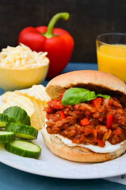 An easy recipe for vegan sloppy joes studded with red pepper and spiced up with paprika and cumin. Serve on a toasted bun with cream cheese and grated cheddar (vegan or veggie, it's up to you). #sloppyjoes #vegan #vegansloppyjoes #dairyfree #veggiemince