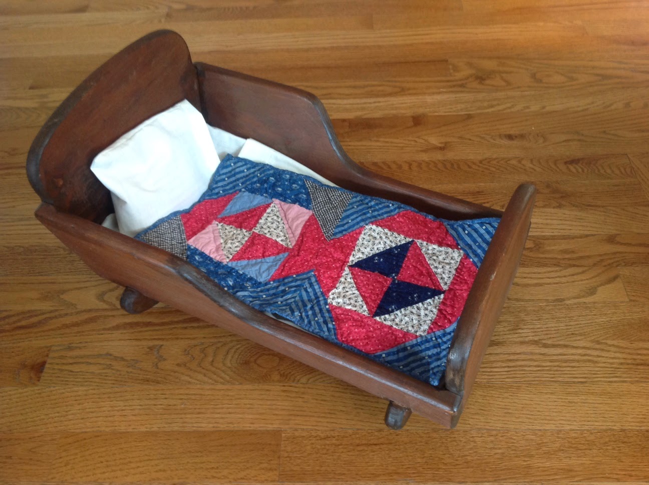 Collector With A Needle Cradle, Doll Quilt and A Kitten