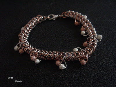 Chainmaille bracelet with small bead charms.