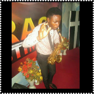 Nigerian boy playing the saxophone