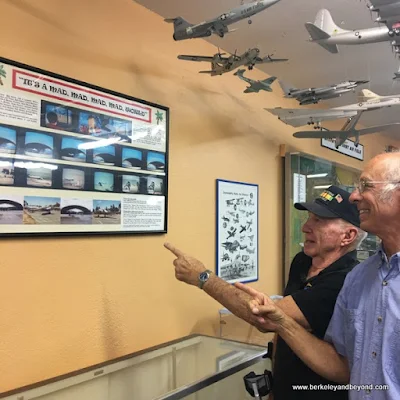 docents C.J.and Andy Werback point to display re. "It's a Mad, Mad, Mad, Mad World" at Pacific Coast Air Museum in Santa Rosa, California