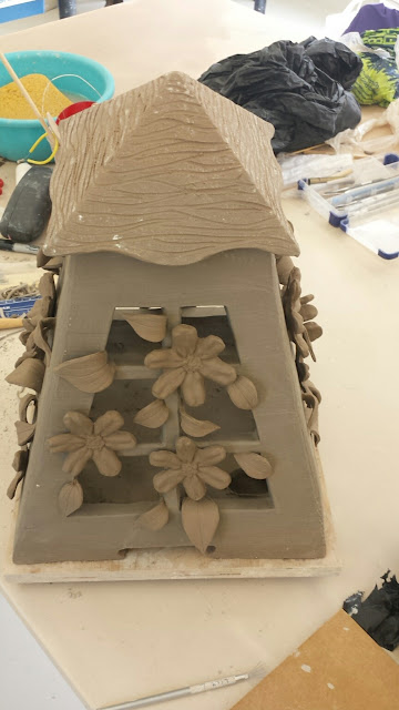 Pottery lantern with clematis design in progress by Lily L.