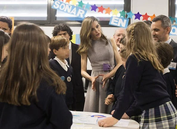 Queen Letizia wore Carolina Herrera coat and dress from Fall 2016 collection and Magrit snake printed pumps