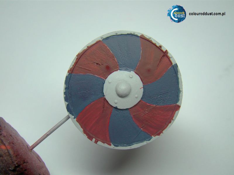 Painting shield using a template. Coloured Dust