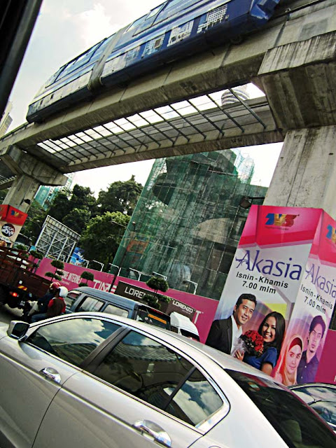 busy city street with metro in Kuala Lumpur Malaysia