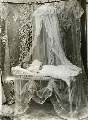 Circa 1900. Child layed out for funeral viewing, no casket