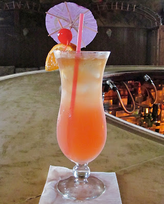 Tropical drink, hurrican glass, umbrella, compound curve bar