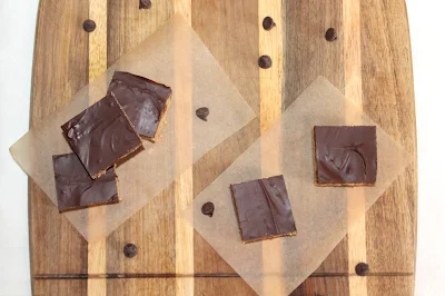 Peanut butter cup bars on a cutting board.