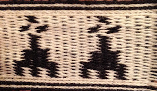 A photograph of a tablet woven showing horizontal ermine spots