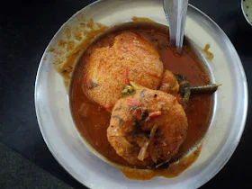 The breakfast table with plates of Idly and Vada