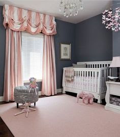 pink theme baby nursery girl polkadot blanket carpet and wall striping and curtain bear monkey dog doll inside basket