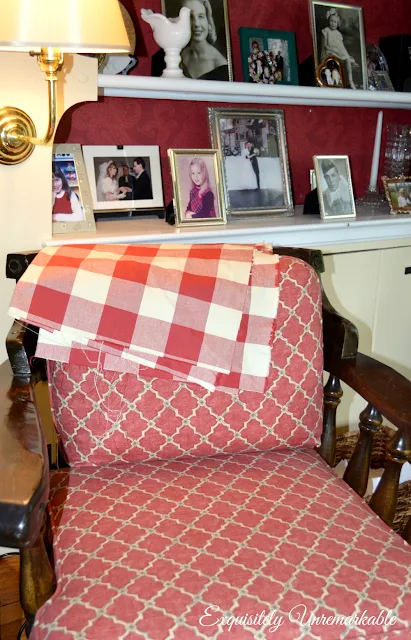 Chair with buffalo check fabric draped over the top