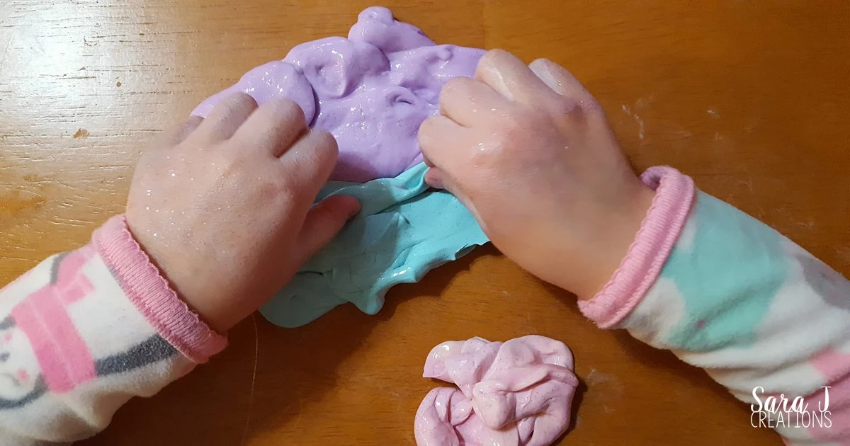 Troll inspired slime recipe.  Make your own homemade slime with troll colors and glitter for an extra sparkle.