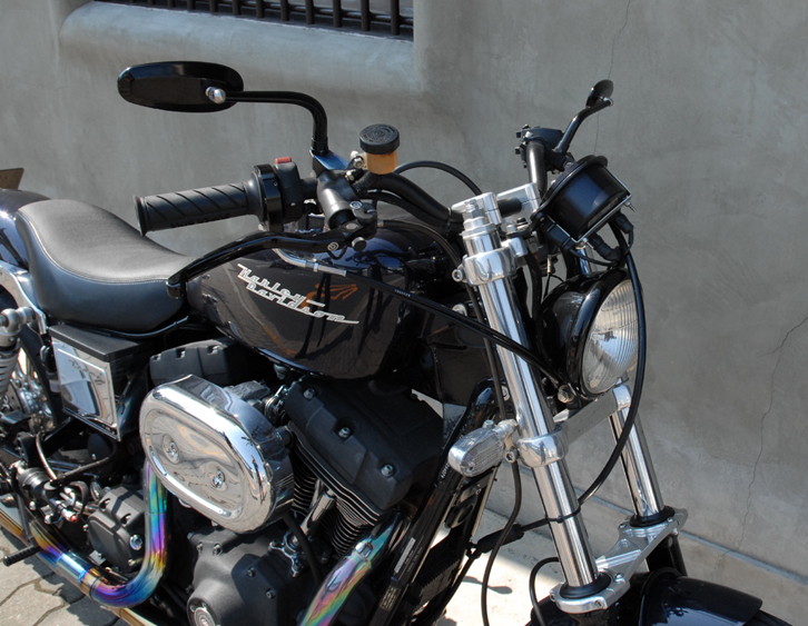 El Corra Motors rearsets on a Dyna