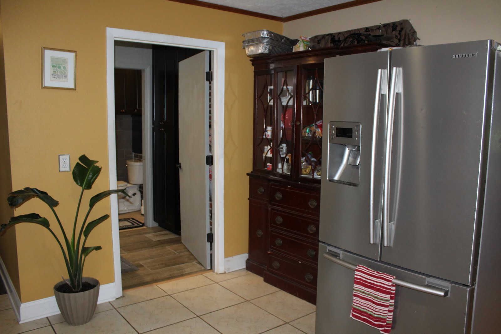 CLICK to view Full bathroom off kitchen entrance. Newly remodeled.