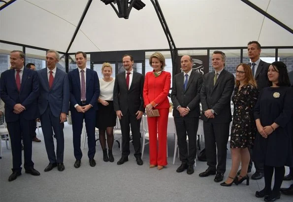 Belvas company is organic chocolate factory in Europe. Queen Mathilde wore Natan red pantsuit and Natan shoes